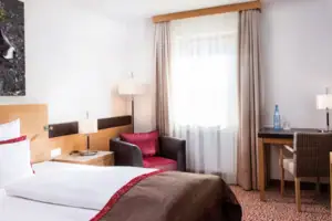 Tweepersoonskamer Slaapkamer met bed en stoel