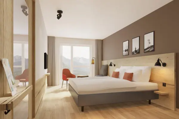 Slaapkamer met bed en stoel